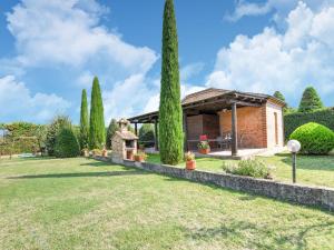 a garden with a brick house with a gazebo at Tranquil Stay in Montepulciano in Acquaviva +31 photos