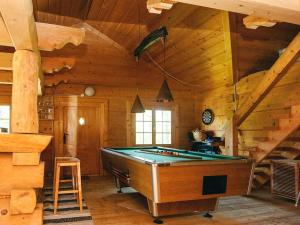 a room with a pool table in a cabin at 8 person holiday home in Ebeltoft in Ebeltoft