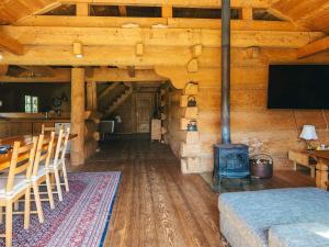 a living room with a woodburning stove in a cabin at 8 person holiday home in Ebeltoft in Ebeltoft