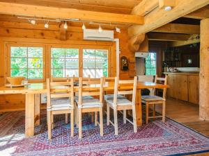 a dining room with a wooden table and chairs at 8 person holiday home in Ebeltoft in Ebeltoft +31 photos