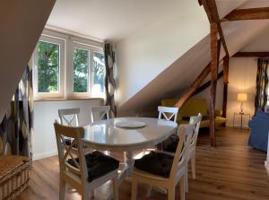 a dining room with a table and chairs at Elbferienhaus-an-der-Elbe in Lenzerwische