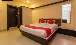 Ένα ή περισσότερα κρεβάτια σε δωμάτιο στο Hotel Pride