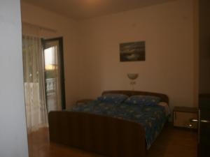 Postel nebo postele na pokoji v ubytování Apartments Gorenjka