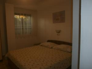 Postel nebo postele na pokoji v ubytování Apartments Gorenjka