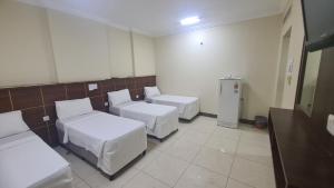 Postel nebo postele na pokoji v ubytování فندق لؤلؤة الشروق