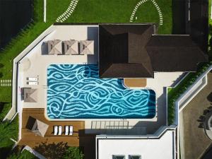 an overhead view of a swimming pool in a house at Hilton Kuching Hotel in Kuching