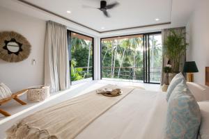 a bedroom with a large bed and a large window at Luxury 5br Villa Private Pool Free Breakfast in Koh Samui  +50 photos