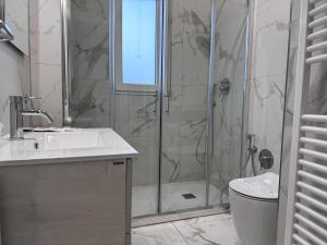 a bathroom with a shower and a sink and a toilet at a casa di Luca in Florence