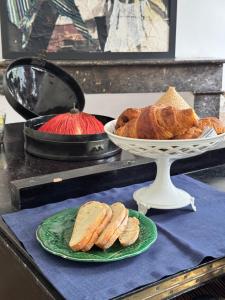 a plate of bread and a bowl of croissants at Chambre au Château in Le Vigan +15 photos