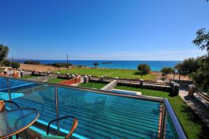a balcony with a view of the beach and the ocean at Holiday home in Kiotari near the beach in Kiotari