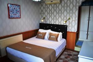 Кровать или кровати в номере Aspawa Hotel