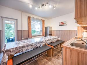 a kitchen with a bench in the middle of it at Villa in Zentrumsnähe, Medebach in Medebach