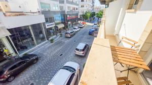 an aerial view of a city street with cars parked at Citycenter Comfy Apartment in Larnaca