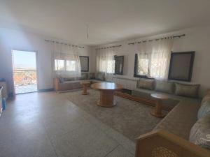a living room with a couch and a table at Apartement khadija in Azrou