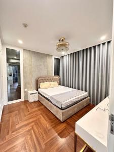 Ένα ή περισσότερα κρεβάτια σε δωμάτιο στο 3 Bedroom Apartment Vinhomes Ocean Park