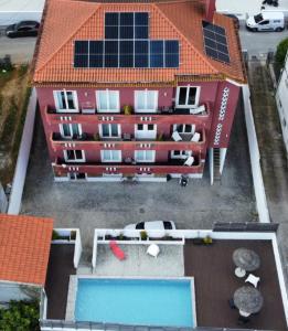 an aerial view of a building with a swimming pool at Casa dos Carvalhos in Coimbra