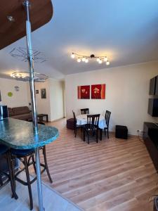 a living room and dining room with a table and chairs at Сдам 3х комнатную квартиру у моря! in Chornomorsk