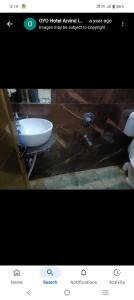 a picture of a bathroom with a sink and a toilet at Hotal Arvind in Patna +10 photos