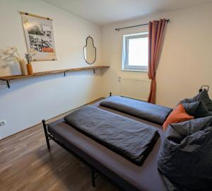 Ένα ή περισσότερα κρεβάτια σε δωμάτιο στο Feld&Flair - Apartment Fürth