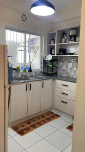 Køkken eller tekøkken på Buxton Point Swahili Cozy Place