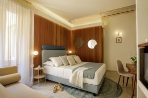 a bedroom with a large bed and a living room at Rome for Two in Rome