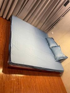 a futon bed with two pillows on the floor at Undertree Life Villa in Hòa Bình +24 photos