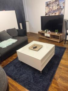 a living room with a couch and a coffee table at Retals Stuttgart City in Stuttgart +6 photos