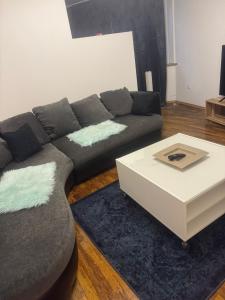 a living room with a couch and a coffee table at Retals Stuttgart City in Stuttgart