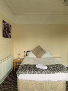 a bedroom with a bed and a side table at 101 - Room 5 - Uplands in Sketty