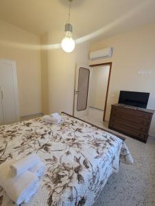 Ένα ή περισσότερα κρεβάτια σε δωμάτιο στο Intero appartamento sul lungomare di Maiori +25 φωτογραφίες