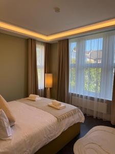 Ένα ή περισσότερα κρεβάτια σε δωμάτιο στο Canewdon Rd Luxury Accommodation