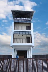 a tall building with the words st croix towers towers at The Pent House in Ernakulam