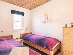 a bedroom with two beds and a window at 5 person holiday home in Vestervig in Vestervig