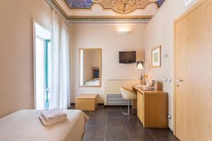TV a/nebo společenská místnost v ubytování Hotel Novecento