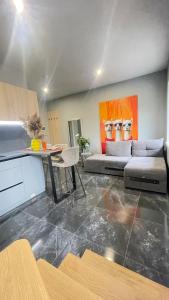 a living room with a couch and a table at Family apartments N5 in Chernivtsi +16 photos