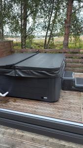 a pool table sitting on top of a deck at Happy Ever After Lodge in Morpeth +16 photos