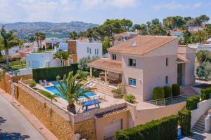 an aerial view of a house with a swimming pool at 3378 Villa Portichol in Moraira