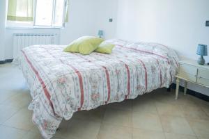 Ένα ή περισσότερα κρεβάτια σε δωμάτιο στο 047B - Casa Le Grigue, tra le Colline e il Mare di Sestri a 10 Minuti di auto dal Mare