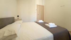 Postel nebo postele na pokoji v ubytování Le rose di Mimmo Casa vacanze