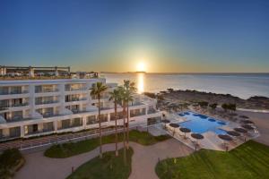 an aerial view of a hotel and the ocean at Can Salia in San Antonio Bay