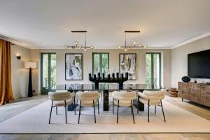 a dining room with a table and chairs at Luxury Villa With Sea View In Le Lavandou in Le Lavandou