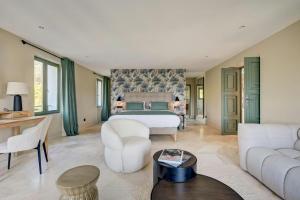 a bedroom with a bed and a living room at Luxury Villa With Sea View In Le Lavandou in Le Lavandou +27 photos
