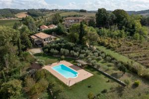 an aerial view of an estate with a swimming pool at Historic Villa With Pool In The Heart Of Chianti in Monteriggioni