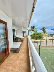 a view from the balcony of a tennis court at Hotel Albemarle Galapagos Beachfront in Puerto Villamil