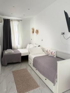 Ένα ή περισσότερα κρεβάτια σε δωμάτιο στο Ready Apartment