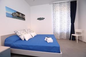 Katil atau katil-katil dalam bilik di Verdemare relax & rooms