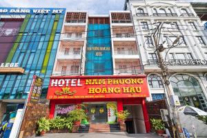 a building with a red sign in front of it at Dancenter Phuong Nam Hospital Formerly Nam Phuong Hoang Hau in Ho Chi Minh City