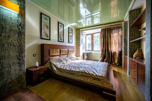 a bedroom with a bed and a window at Tokyo Luxury apartment in Odesa +29 photos