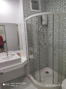 a bathroom with a shower and a sink at Kamala Regent in Kamala Beach