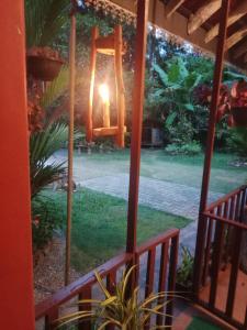 a view of a garden from the porch of a house at Minu Homestay & Villa in Weligama +55 photos